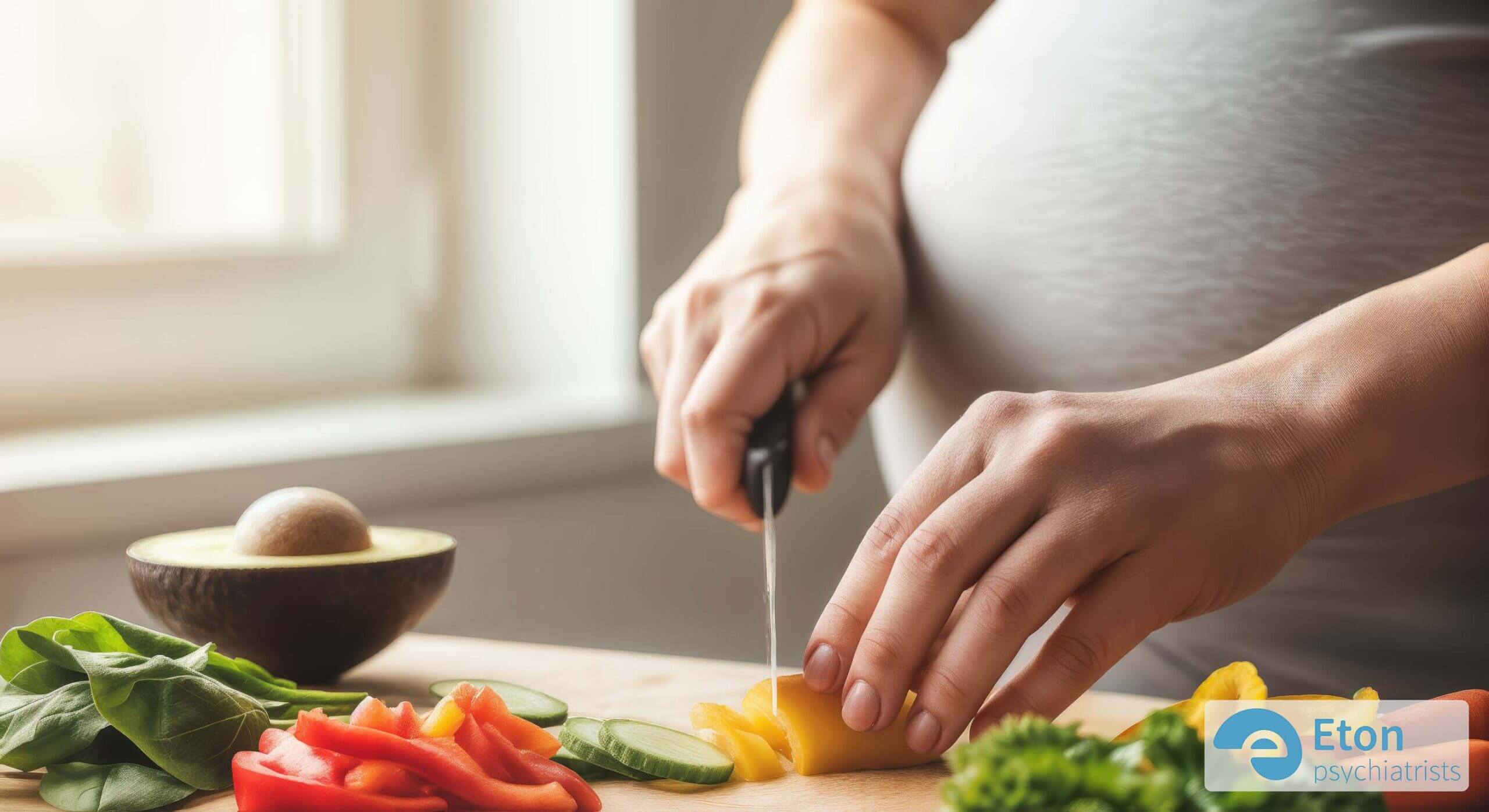 A pregnant woman's hands preparing a healthy, vibrant meal, representing proactive steps for a healthy pregnancy.