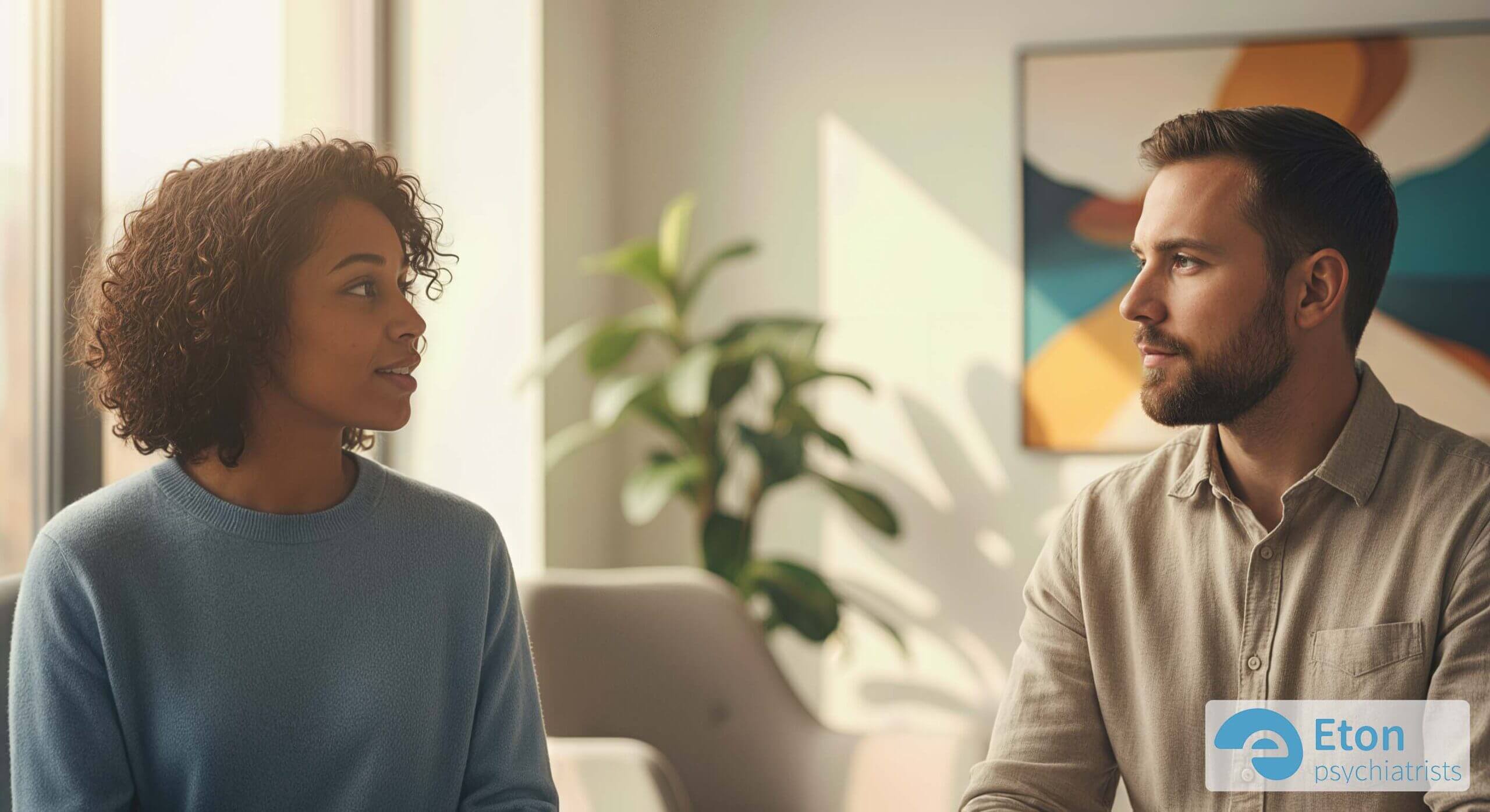 Two colleagues having a respectful and empathetic conversation, representing neurodiversity allyship in the workplace.