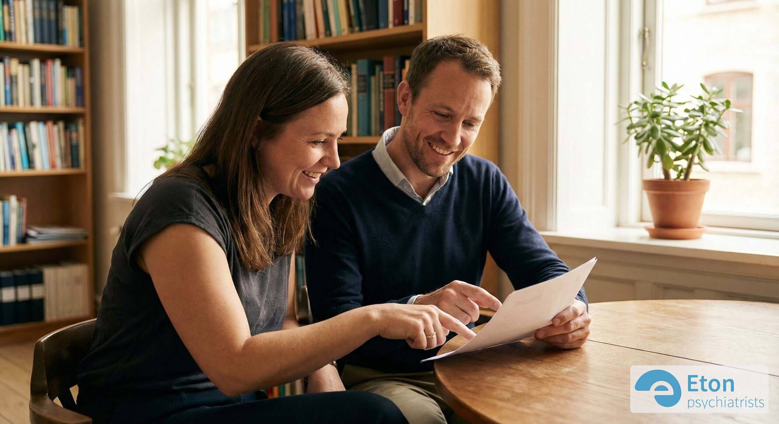 A man and woman looking over documents together, representing the collaborative nature of the assessment process.